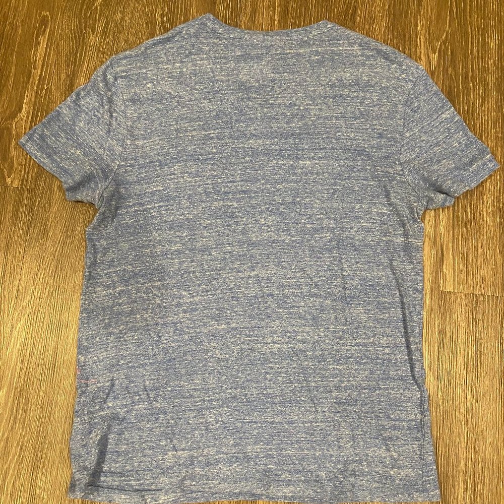 Medium Marc Anthony tee shirt with front pocket. bright blue primary color
